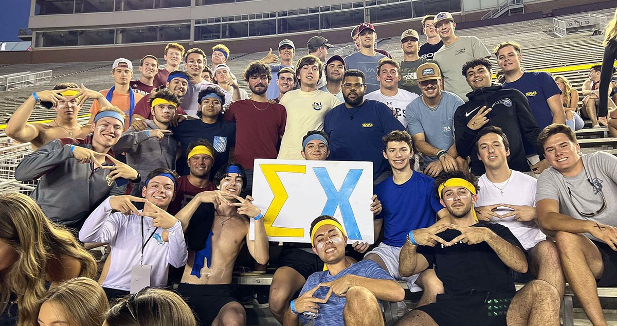 Fraternity brothers in a stadium