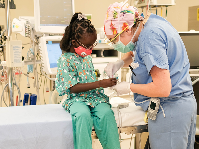 child receiving carefrom a doctor